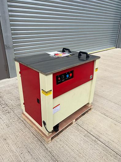 BRAND NEW STRAPPING MACHINE