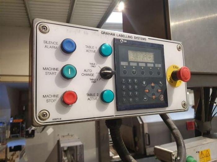 Used 2002 Graham Captain Twin Head Labeller with Top Hold Conveyor