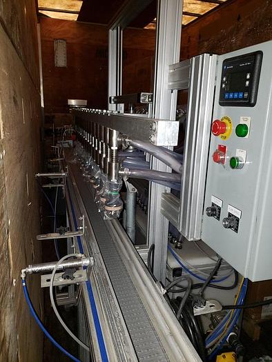 Used EQUIPMENT EXPRESS BOTTLING LINE (FILLER AND CAPPER)