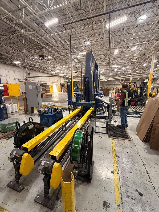 Used Signode 2 head Unitizer with internal Turntable and pallet void feeders