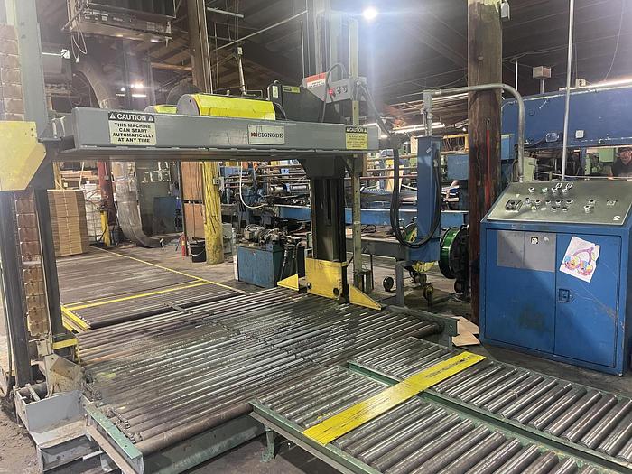 Used Signode 2 head Unitizer,  in operation