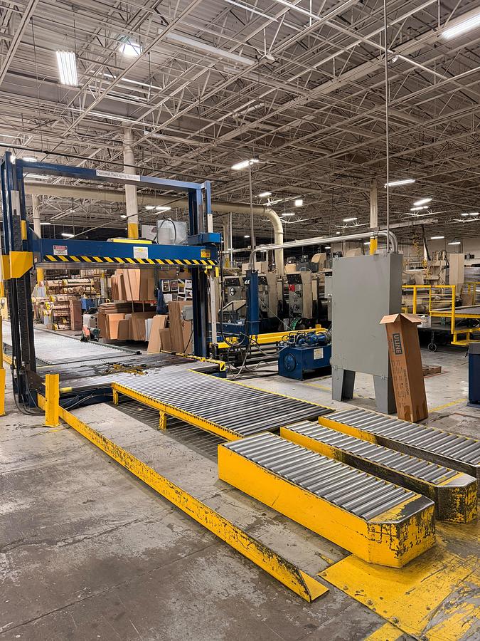 Used Signode 2 head Unitizer with internal Turntable and pallet void feeders