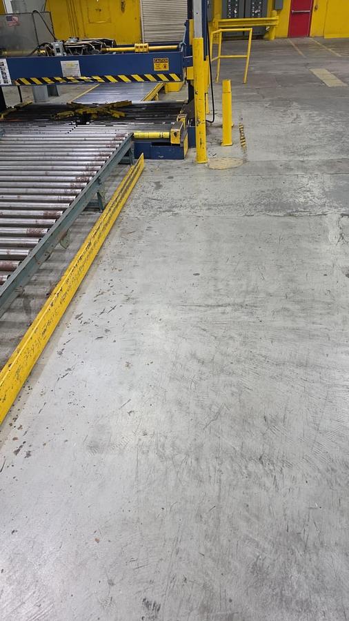 Used Signode 2 head Unitizer with internal Turntable and pallet void feeders
