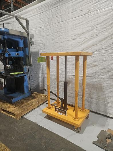 Used Hydraulic Post Lift Table 2000 Lb Capacity 59 Inch Raised Height Table is 24x36 Inch 