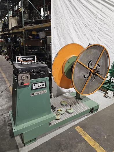 Used 4" Stock Leveler with double adjustable payoff reels stock feed press side