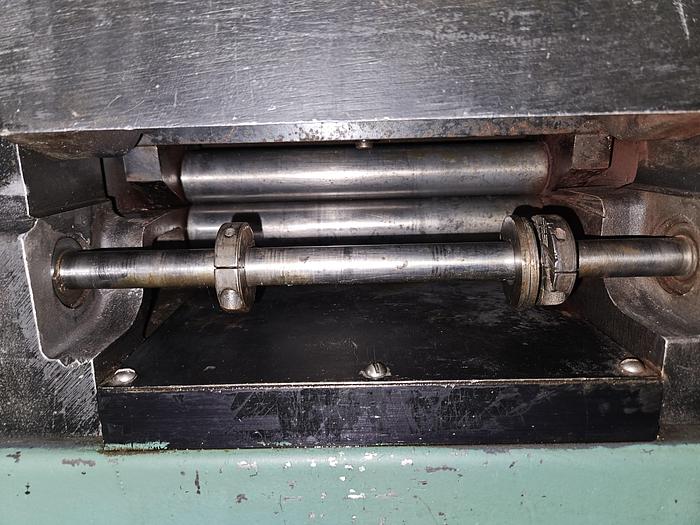 Used 4" Stock Leveler with double adjustable payoff reels stock feed press side