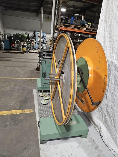 Used 4" Stock Leveler with double adjustable payoff reels stock feed press side