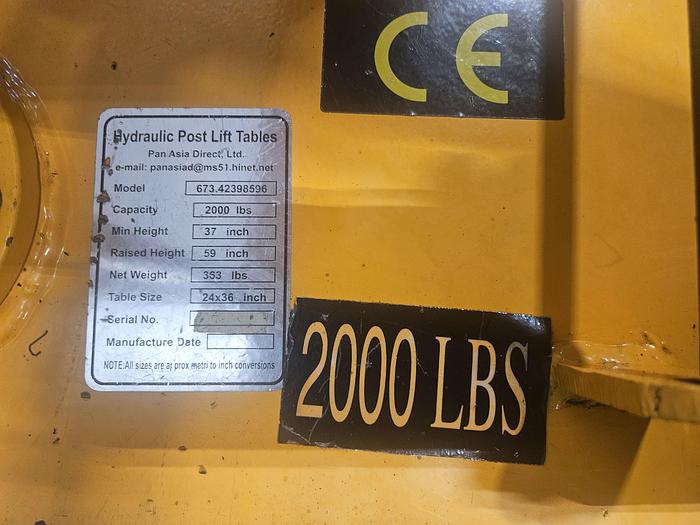 Used Hydraulic Post Lift Table 2000 Lb Capacity 59 Inch Raised Height Table is 24x36 Inch 