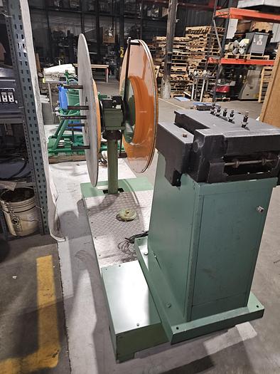 Used 4" Stock Leveler with double adjustable payoff reels stock feed press side