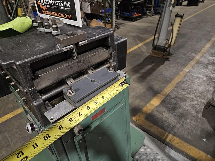 Used 4" Stock Leveler with double adjustable payoff reels stock feed press side