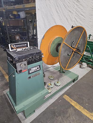 Used 4" Stock Leveler with double adjustable payoff reels stock feed press side