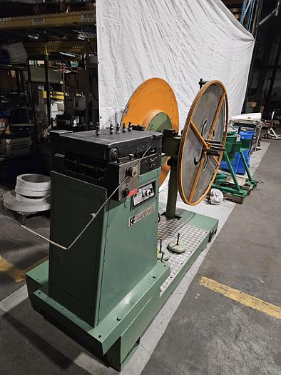 Used 4" Stock Leveler with double adjustable payoff reels stock feed press side