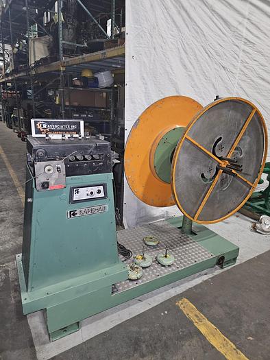 Used 4" Stock Leveler with double adjustable payoff reels stock feed press side