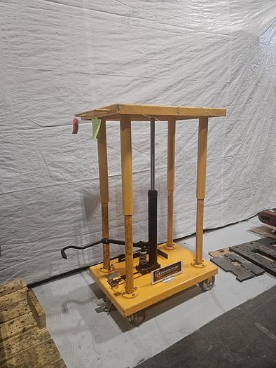 Used Hydraulic Post Lift Table 2000 Lb Capacity 59 Inch Raised Height Table is 24x36 Inch 