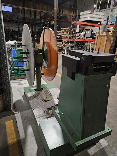 Used 4" Stock Leveler with double adjustable payoff reels stock feed press side