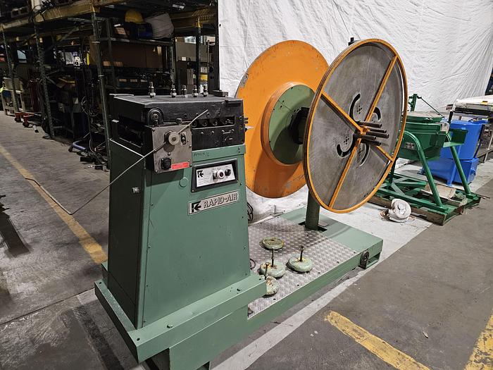 Used 4" Stock Leveler with double adjustable payoff reels stock feed press side