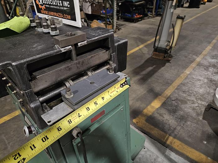 Used 4" Stock Leveler with double adjustable payoff reels stock feed press side