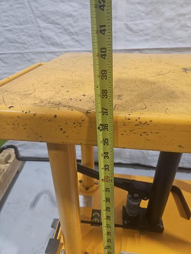 Used Hydraulic Post Lift Table 2000 Lb Capacity 59 Inch Raised Height Table is 24x36 Inch 