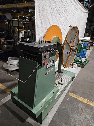 Used 4" Stock Leveler with double adjustable payoff reels stock feed press side