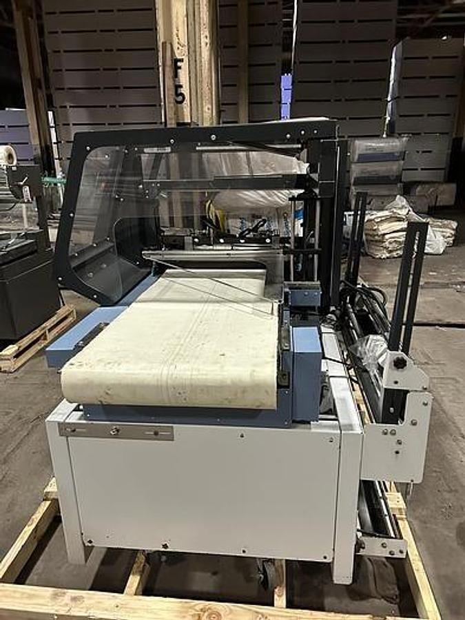 Used CONFLEX FUSION SIDE SEAL SHRINK WRAPPER OPERATING SPEED 100 FEET PER MINUTE