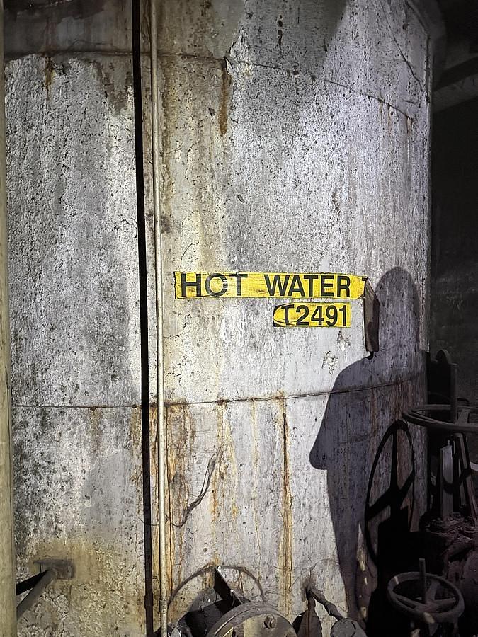 Used 7,000 GALLON 11' DIAMETER X 10' TALL TANK STAINLESS STEEL