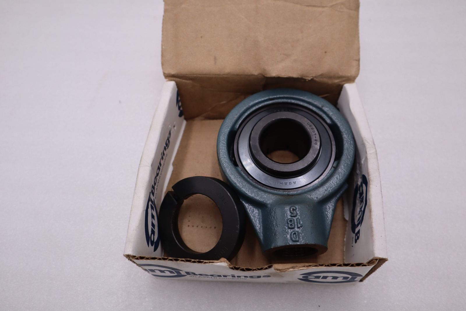 Used UEECH207-20 - AMI - WIDE ACCU-LOC HANGER BEARING STOCK H906A