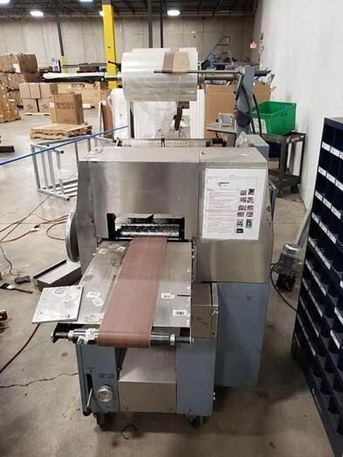 Used AMERIPAK # 40 HORIZONTAL WRAPPER w/ 10’ SS LUGGED INFEED CONVEYOR