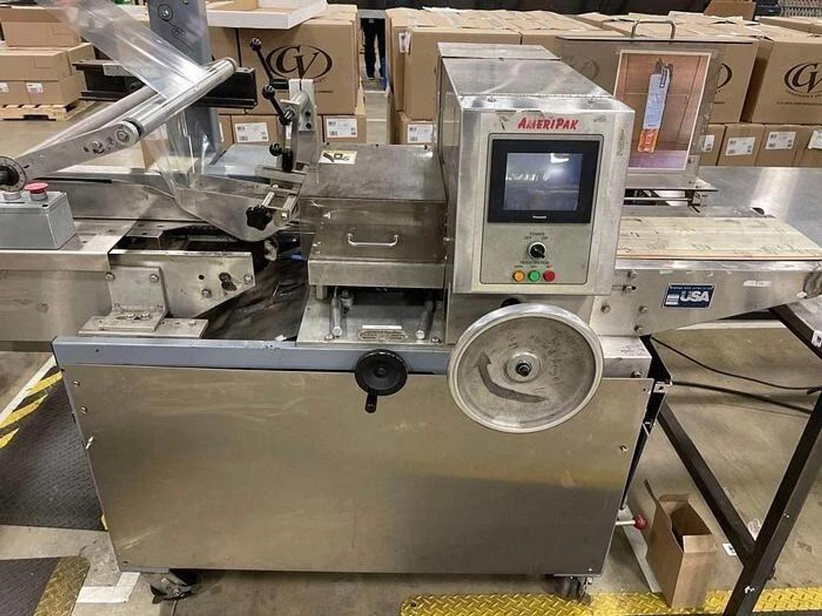Used AMERIPAK # 40 HORIZONTAL WRAPPER w/ 6’ SS LUGGED INFEED CONVEYOR