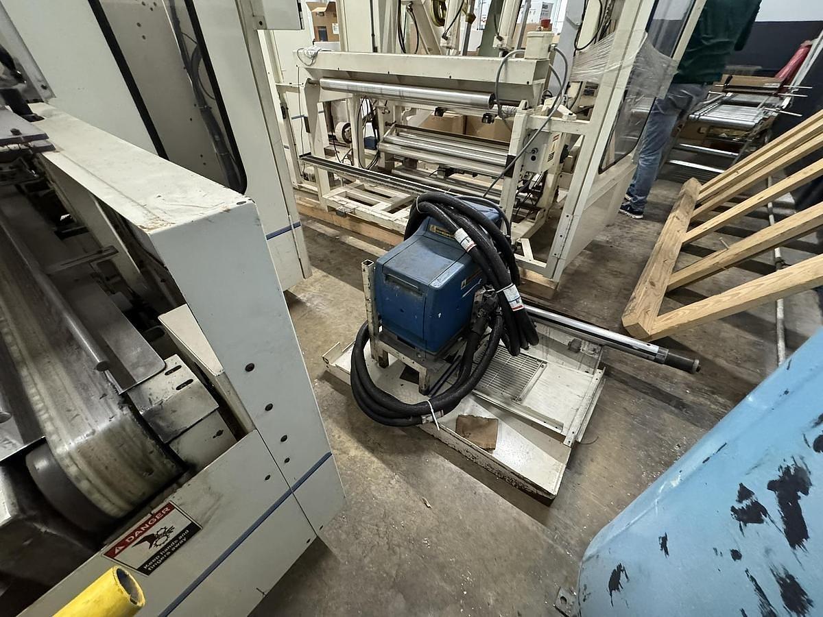 Used 42" WIDE ELSNER ENR-1000 AUTOMATIC REWINDER FOR NONWOVEN WIPES 10" REWIND DIA.