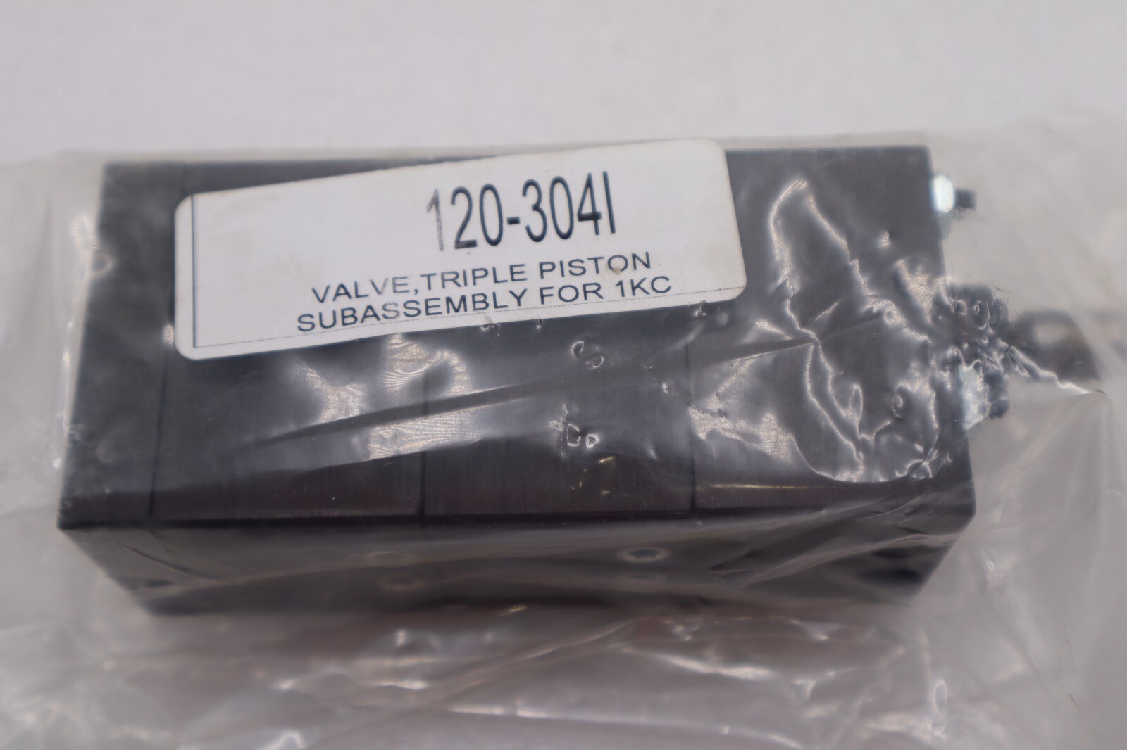 Used VALVE, TRIPLE PISTON SUBASSEMBLY FOR 1KC 120-3041 STOCK #K-1785
