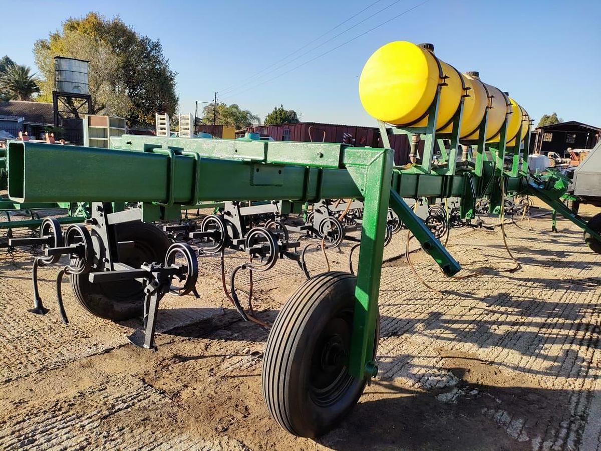 Used 12 ROW SPRING DISK PLOW WITH LIQUID FERTILIZER TANK INDUSER (NOT TESTED)
