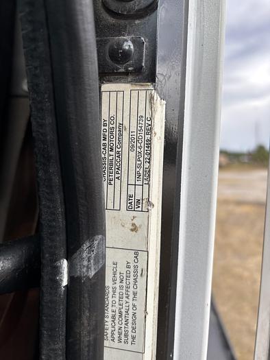 Used 2012 Peterbilt 365 Tri-Axle Roll-Off Truck