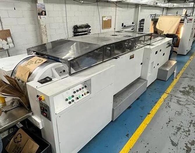 Used (visible in production) 1995 CURIONI SUN MASTER 540 - Reel fed Square bottom paper bag making machine with in line twisted handle unit