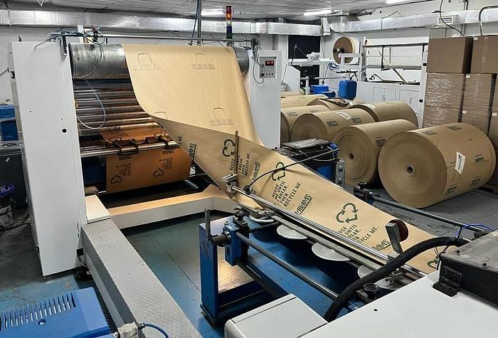 Used (visible in production) 1995 CURIONI SUN MASTER 540 - Reel fed Square bottom paper bag making machine with in line twisted handle unit