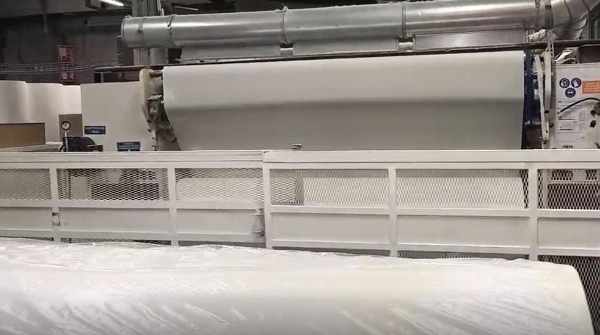 Used (visible in production) 1999 FABIO PERINI 702G slitter rewinder + 2003 MACDUE packaging line | for production and packaging of tissue rolls