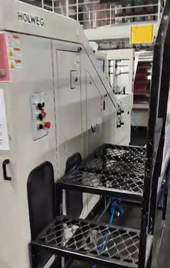 Used (visible in production) 2013 HOLWEG WEBER 5XF - Roll fed square bottom paper bag malking machine with TWISTED handles unit