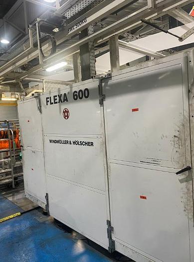 Used (visible in production) 2012 W&H FLEXA (reel-to-reel) 4 col. Stack flexo with FILMATIC® S Mono-Winder & Unwind unit (1570 mm)
