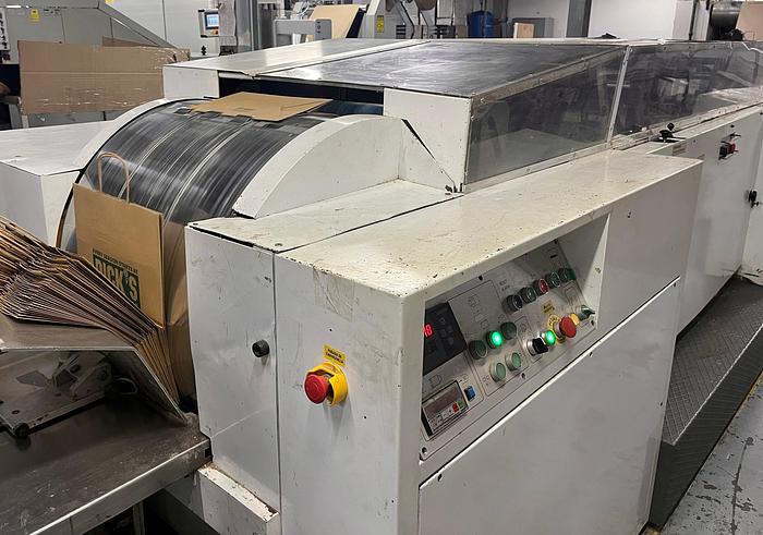 Used (visible in production) 1996 CURIONI SUN MASTER 540 Reel fed Square bottom paper bag making machine with in line twisted handle unit