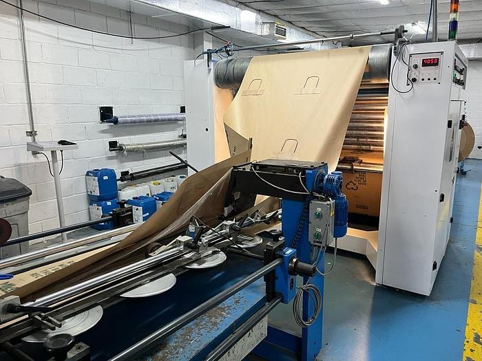 Used (visible in production) 1995 CURIONI SUN MASTER 540 - Reel fed Square bottom paper bag making machine with in line twisted handle unit