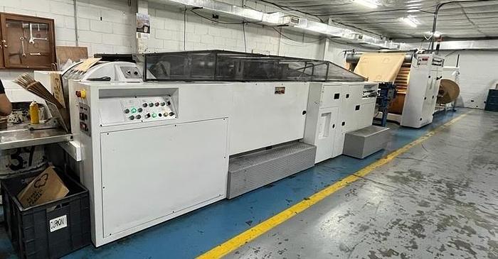 Used (visible in production) 1995 CURIONI SUN MASTER 540 - Reel fed Square bottom paper bag making machine with in line twisted handle unit