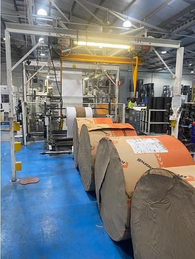 Used (visible in production) 2012 W&H FLEXA (reel-to-reel) 4 col. Stack flexo with FILMATIC® S Mono-Winder & Unwind unit (1570 mm)