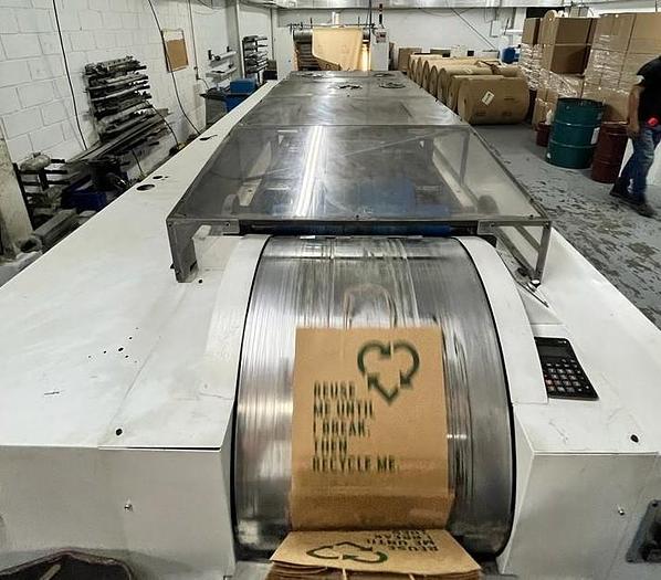 Used (visible in production) 1995 CURIONI SUN MASTER 540 - Reel fed Square bottom paper bag making machine with in line twisted handle unit