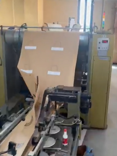 Used (visible in production) 2001 CURIONI SUN MASTER 540 - square bottom paper bag making machine with twisted handles unit