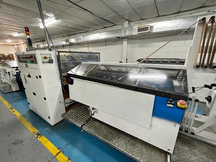 Used (visible in production) 1995 CURIONI SUN MASTER 540 - Reel fed Square bottom paper bag making machine with in line twisted handle unit