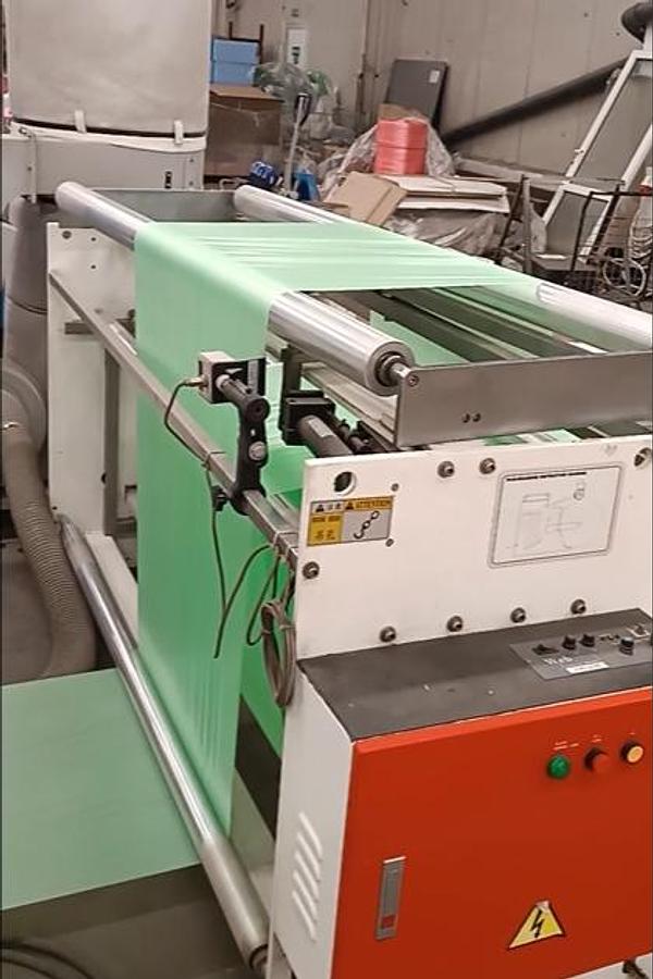 Used (visible in production) 2012 HEMINGSTONE HM-1250MSR+IL - Machine for drawtape garbage bag on roll, flat bottom; side seal.