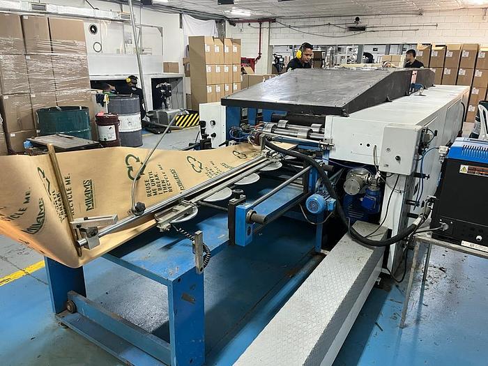 Used (visible in production) 1995 CURIONI SUN MASTER 540 - Reel fed Square bottom paper bag making machine with in line twisted handle unit