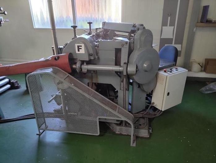 Used (visible in production) WINDMÖLLER & HÖLSCHER (W&H) Turners - triangle bag making machine