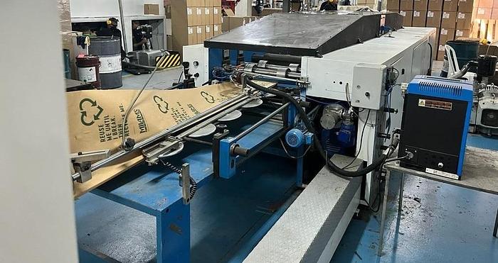 Used (visible in production) 1995 CURIONI SUN MASTER 540 - Reel fed Square bottom paper bag making machine with in line twisted handle unit