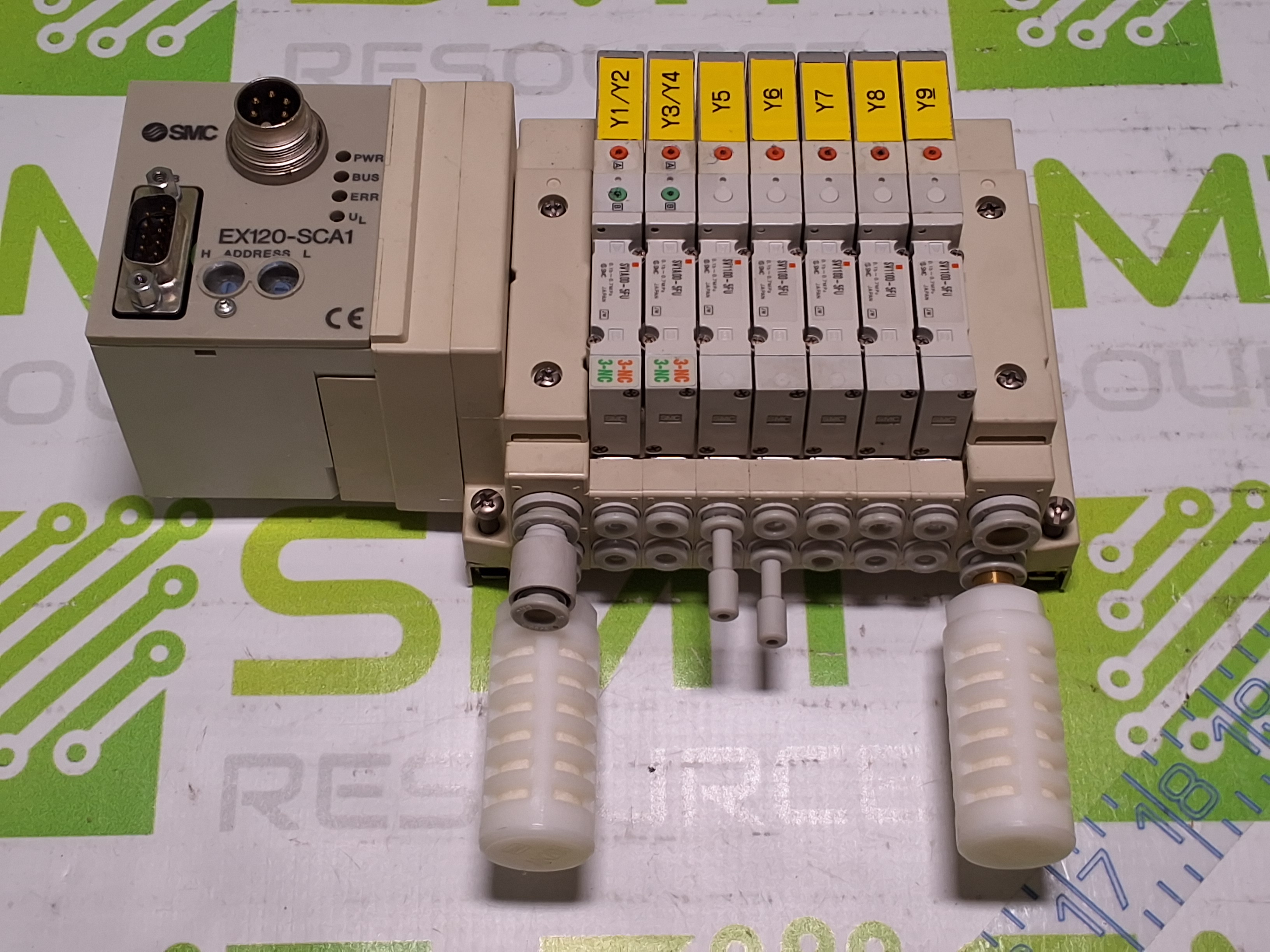 Used SMC EX120-SCA1 CONTROLLER AND 5 PORT MANIFOLD WITH 7 SMC SOLENOID VALVES