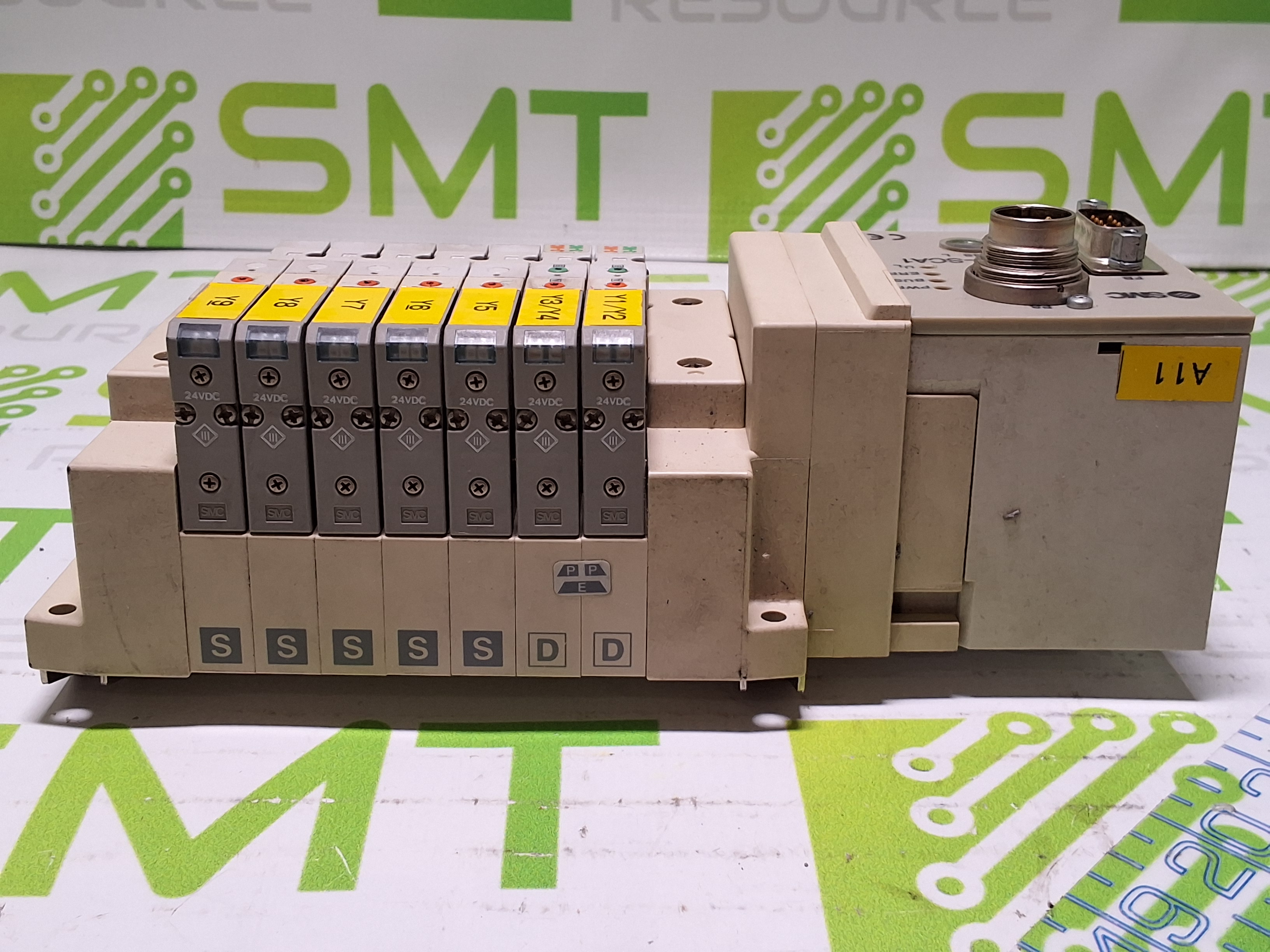 Used SMC EX120-SCA1 CONTROLLER AND 5 PORT MANIFOLD WITH 7 SMC SOLENOID VALVES